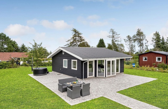 A modern and bright vacation home welcomes you to Bogø.
