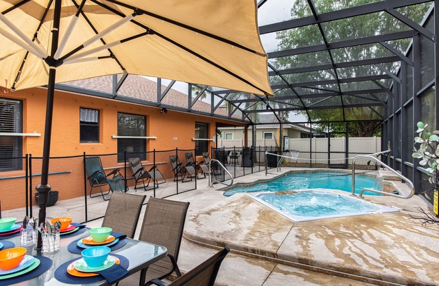 A peaceful tropical oasis with a large saltwater pool and spa hot tub.