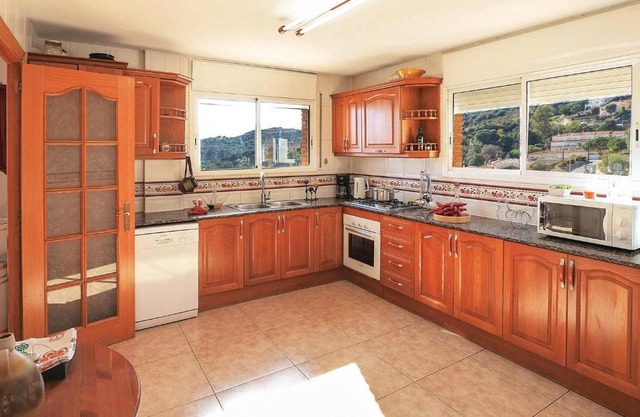 Amazing home in Alella with 5 Bedrooms, WiFi and Swimming pool