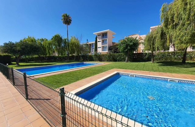 Apartment in lovely setting with two pools
