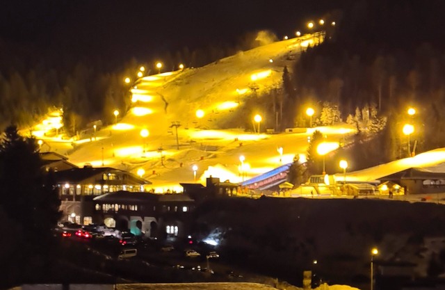 At the foot of the ski resort with a view of the slopes