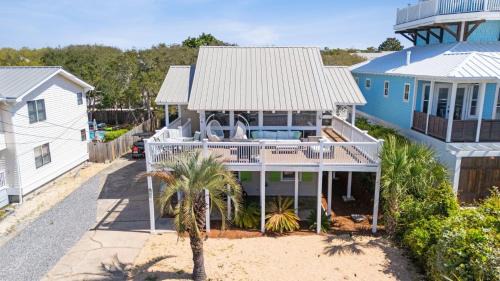 Beach Retreat w Sundeck Golf Cart Bikes Bungalow House by AvantStay