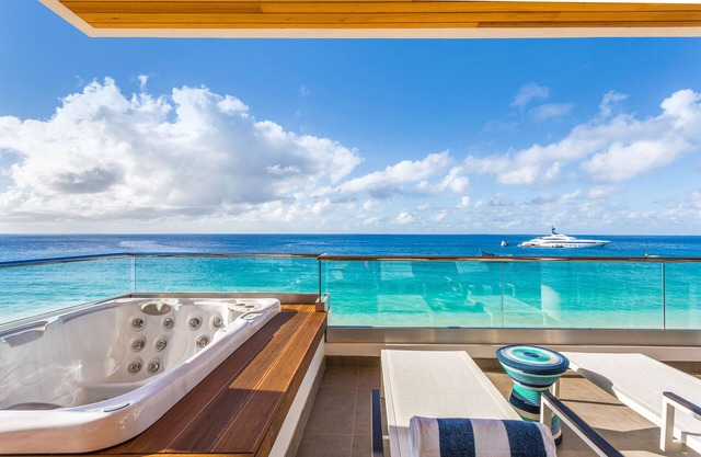 BEACHFRONT PENTHOUSE VILLA AT AWARD-WINNING BOUTIQUE RESORT ON MEADS BAY BEACH