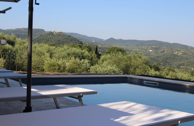 Beautiful natural stone house with pool in the middle of an olive grove