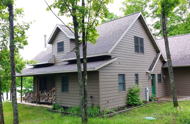 Beautiful newer home on the sunny side of peaceful Camp Lake in Iron River