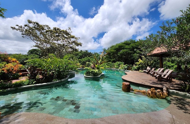 Beautiful tropical farm with spectacular pool located on a river.