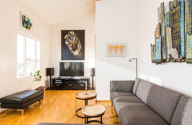 Bright & stylish flat with modern art, big balcony & hot tub. Family friendly.