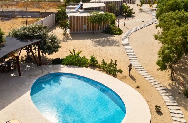 Bungalow on the beach in front of the warm and calm sea of Canoas de Punta Sal.