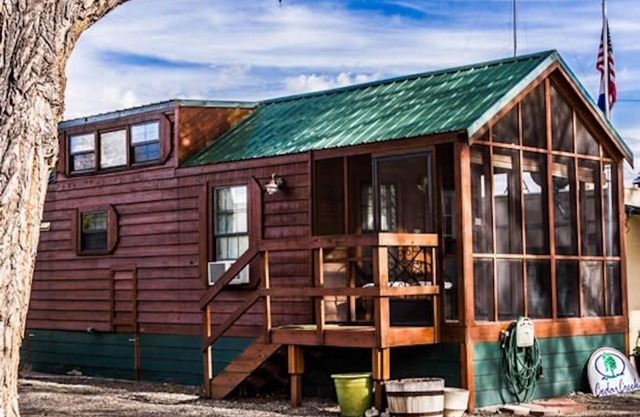 Cabin with one queen bed, two lofted twin-size beds and a queen pull out couch Sleeps: 6 Pets: 2 Parking: 1