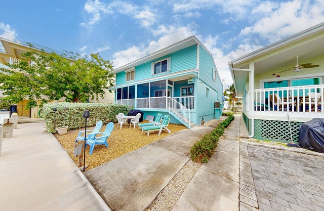 Canal-front duplex with Cabana Club membership, private dock, canal views, grill