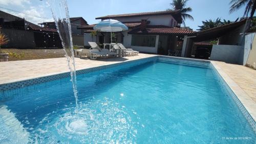 Casa piscina pé na areia Bertioga