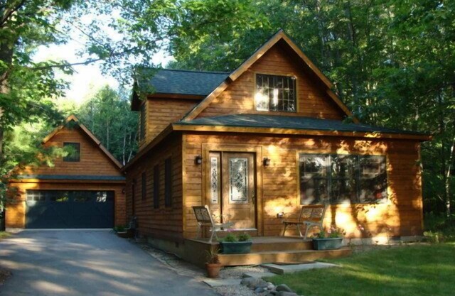 Charming quality built home with private Mullett Lake beach access