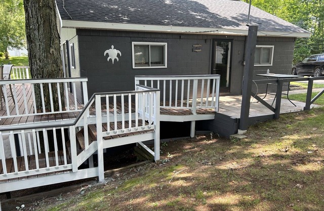 Cozy cottage in Glennie MI on all sports North Lake with deck, dock & firepit.