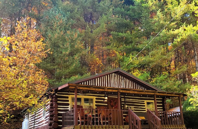 Cozy Hand Built Log Cabin Rocking Chair Porch King Bed
