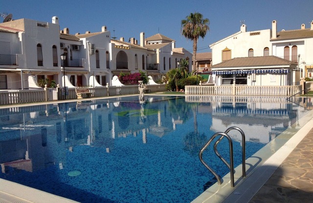 Delightful family villa in secure gated community with large pool.