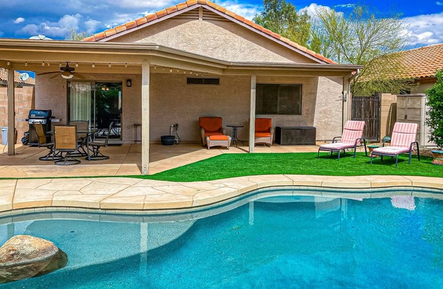 Desert charmer with enclosed yard, heated pool, smart TVs, W/D, & full kitchen
