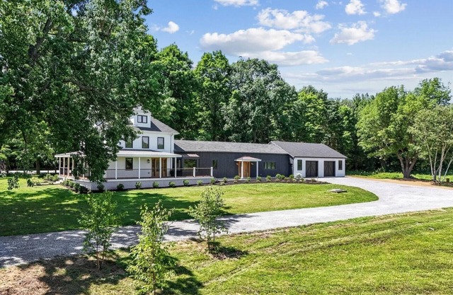 Designer 5-bedroom farmhouse with private lake access in rural Monmouth Maine.