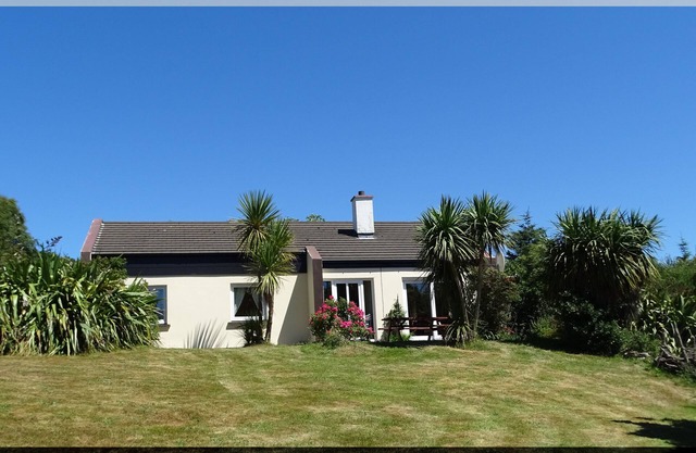 Detached house with a dream view of Kenmare Bay in a subtropical garden