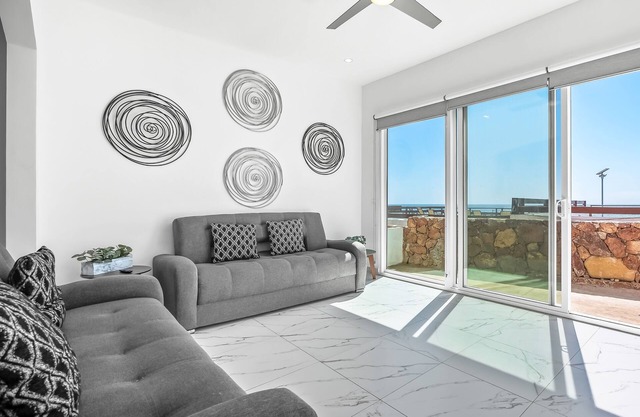Dog-friendly home with heated pool, hot tub, partial ocean views, & balcony