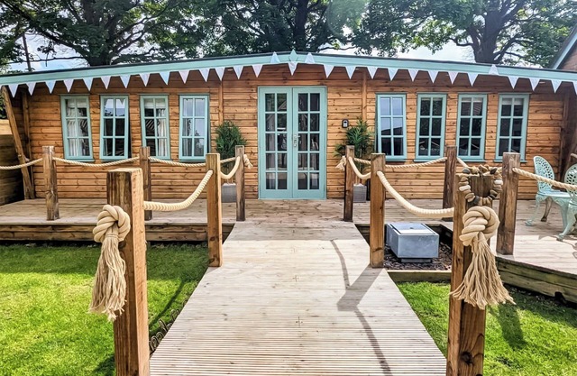 Elegantly finished lodge with a private, decked garden.