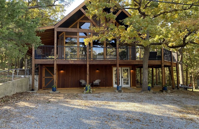 Engaging Texoma tri-story home in the trees with space for all personalities!