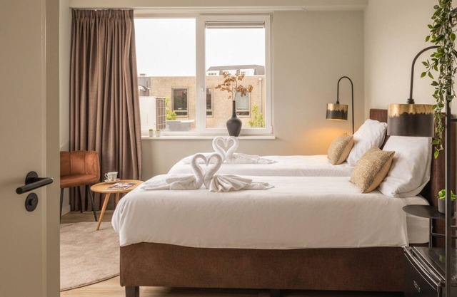 Enjoy a stylish room designed for both relaxation and productivity. Sleep soundly on a luxurious box-spring bed (twin or double setup), work or dine comfortably at your table, and stay cool with air conditioning. Your private bathroom, TV, and fridge