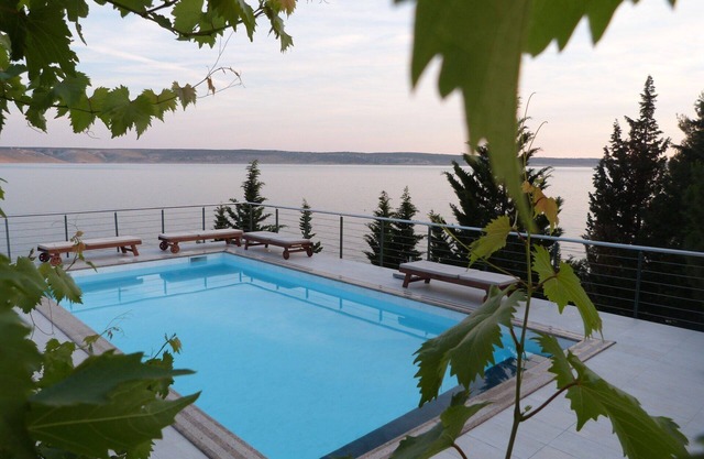 Exceptional apartment with infinity pool and a private beach in beachfront villa