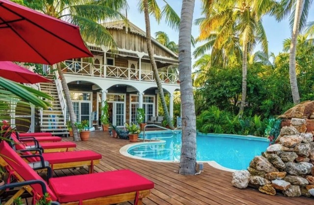 Experience laid-back luxury in our Cozy poolside studio with beautiful gardens