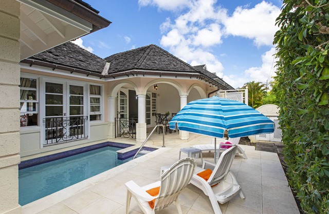 Explore a peaceful 2 bedroom house with a path that leads to the gorgoues water