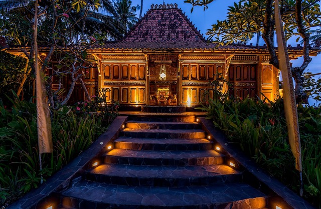 Exquisite beachfront joglo in lush coconut grove