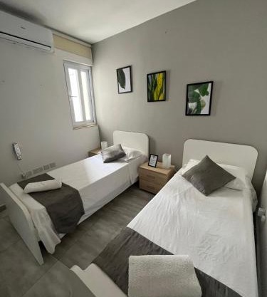 Habitación Camas Sencillas Baño Compartido 
