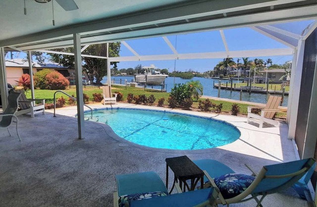 Family beach home! Fully renovated on water w/pool, boat dock & nearby beach