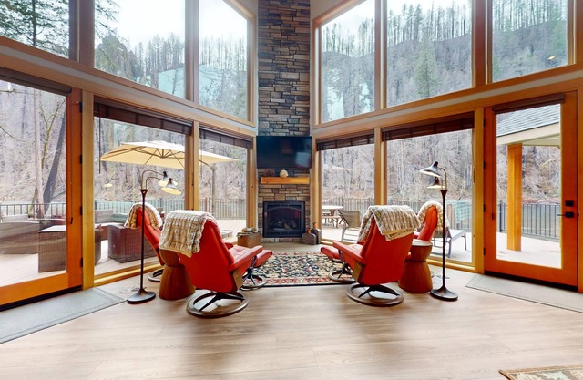 Fully rebuilt riverfront home with deck, fireplace, & W/D - dog-friendly