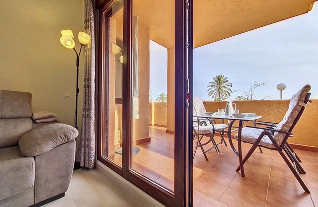 Ground floor with terrace and pool views