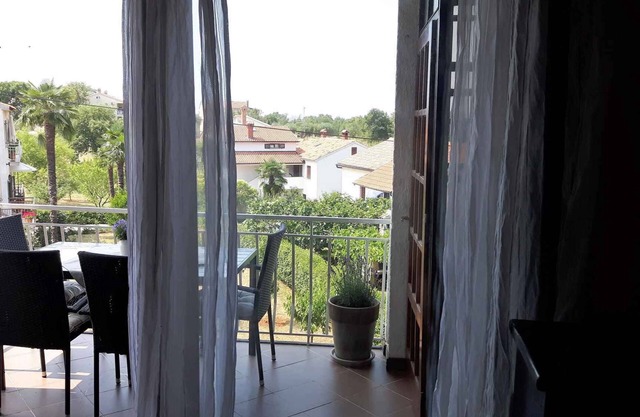 Holiday apartment with balcony and air conditioning