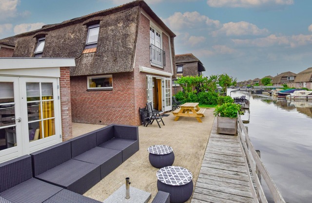 Holiday home with waterside terrace