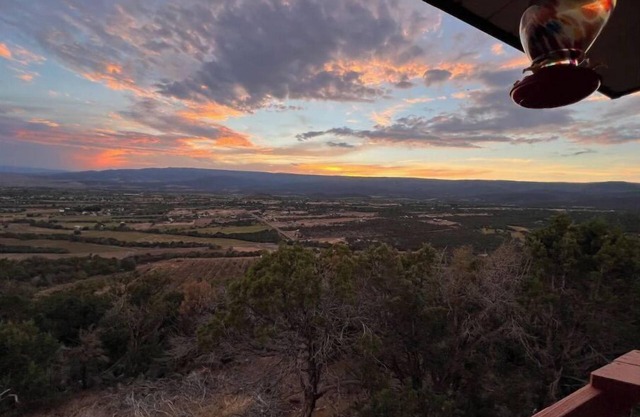 Home on the mesa’s edge the Proverbial Million Dollar View, jacuzzi and orchard