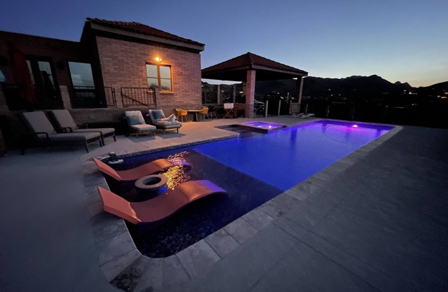 Home with lap pool, hot tub, and wonderful views