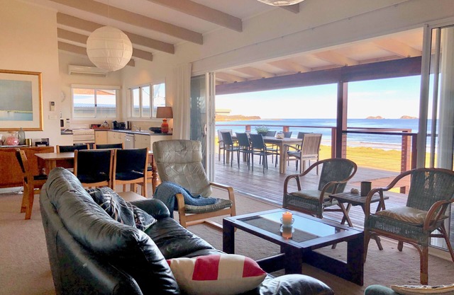 House at the beach, the sounds of waves on the breeze