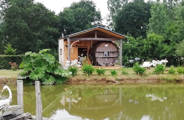 INSOLITE A barrel in a green setting