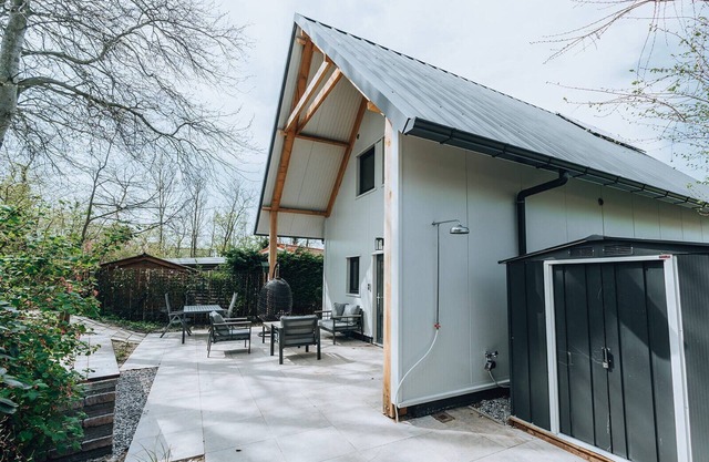 La Folie': a large, elegantly furnished holiday home with plenty of privacy at the back of a green family park.