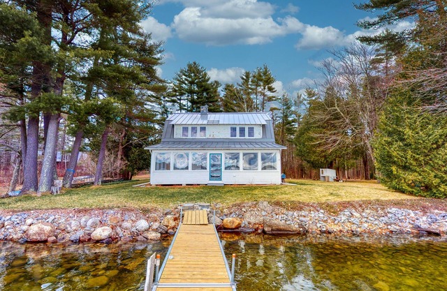 Lakefront home with private dock, kayaks, firepit, grill, & sunroom