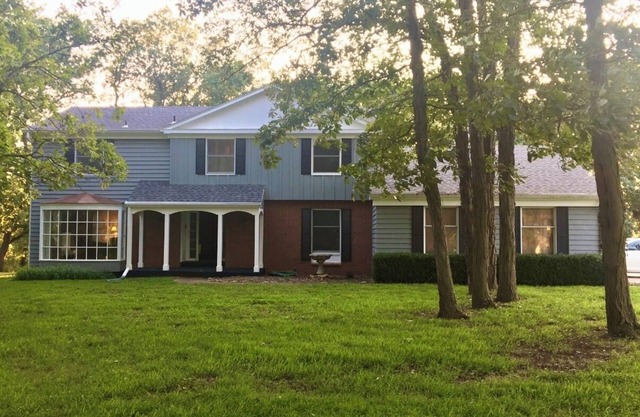 Large secluded 4 bedroom home in the timber with views of Perry Lake.