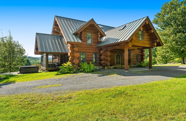 Log manor on 65 private acres of land with entertaining amenities & hot tub