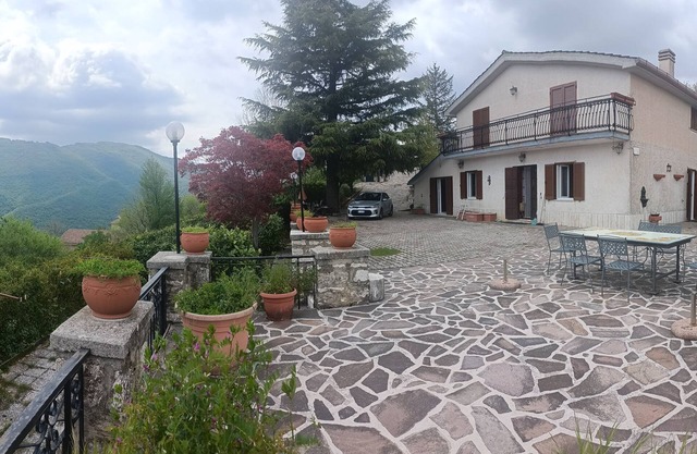 LOOKS OUT ON THE ANENE VALLEY IN FRONT OF SIMBRUINI MOUNTAINS