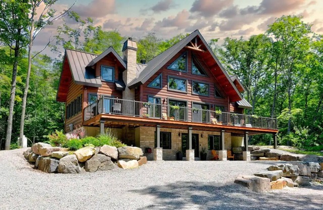 Luxurious chalet featuring a jacuzzi, pool, small lake, sauna and pool table.