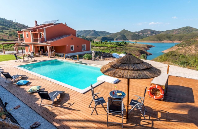 Luxurious villa with pool and idyllic lake landscape