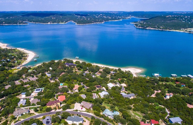 Luxury home with private boat dock, huge yard by the water, Sand Volleyball, Hot Tub, Lake views!