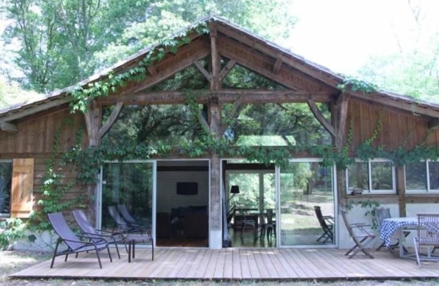 Luxury reconverted barn house classified * with charm and character and large picture windows in the middle of a huge wooded park near the ocean
