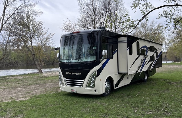 Luxury RV with Bunkbeds Stationed on serene Grand River with private golf course